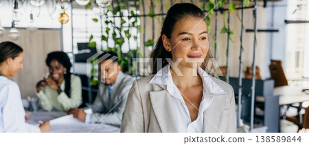 Supportive Asian guide helps team through notes and tasks Supportive Asian guide helps team through notes and tasks 138589844