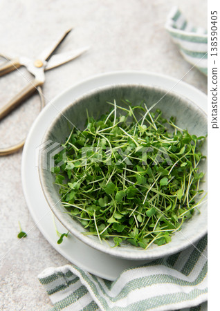 Fresh microgreens in bowl with scissors for healthy eating Fresh microgreens in bowl with scissors for healthy eating 138590405