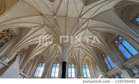 Wide view of gothic hall with complex ribbed vault ceiling tall windows and central column in Malbork Castle Poland. Architecture, heritage and historic interior concept Wide view of gothic hall with complex ribbed vault ceiling tall windows and central column in Malbork Castle Poland. Architecture, heritage and historic interior concept 138590492