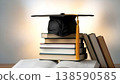 A black academic cap with a yellow tassel on a stack of textbooks and books symbolizes an academic degree, school graduation, and achievement of goals. 138590585