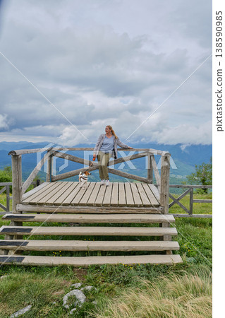 Happy Woman with Jack Russell Terrier on Mountain Viewpoint Happy Woman with Jack Russell Terrier on Mountain Viewpoint 138590985
