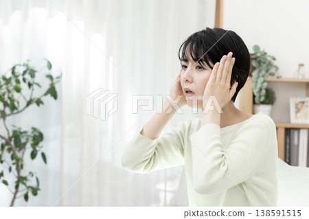 Young woman with a headache; headache; migraine. Young woman with a headache; headache; migraine. 138591515