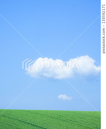 A simple yet refreshing summer scene in Biei, Hokkaido, with white clouds and a clear blue sky. A simple yet refreshing summer scene in Biei, Hokkaido, with white clouds and a clear blue sky. 138592171