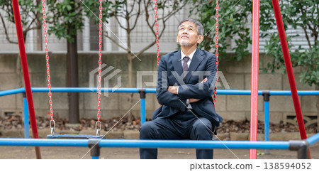 A troubled businessman in a park A troubled businessman in a park 138594052