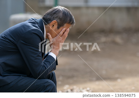 depressed businessman 138594075