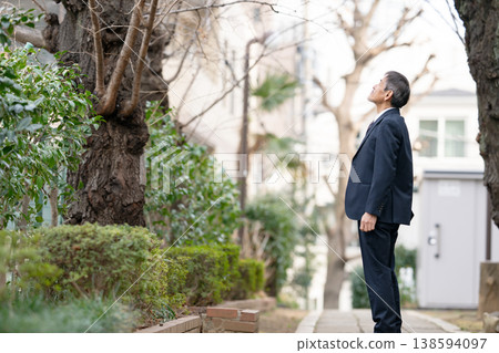 A businessman walking, sideways. A businessman walking, sideways. 138594097
