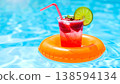 Refreshing Summer Drink Floating in Pool 138594134