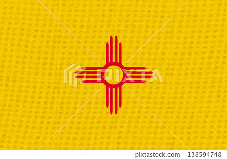 American state New Mexico flag on fabric surface. New Mexico state flag American state New Mexico flag on fabric surface. New Mexico state flag 138594748