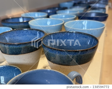 Ceramic cups forming a blue gradient with a soft focus, ideal for texture and color background Ceramic cups forming a blue gradient with a soft focus, ideal for texture and color background 138594772
