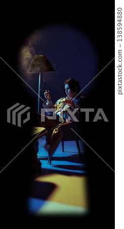 Stylish woman smoking cigar and drinking whiskey in armchair under dramatic lighting seen through keyhole Stylish woman smoking cigar and drinking whiskey in armchair under dramatic lighting seen through keyhole 138594880