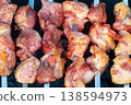 Barrel Used for Grilling Beef,. Lots of white smoke with a delicious aroma is coming out of the barrel hole. 138594973