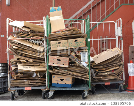 Used cardboard boxes piled up on a cart 138595706