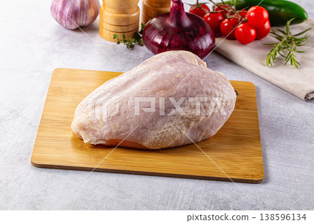 Raw chicken breast with bone and skin Raw chicken breast with bone and skin 138596134