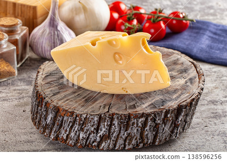Yellow maasdam cheese triangle piece Yellow maasdam cheese triangle piece 138596256