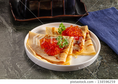 Russain traditional pancakes with red caviar Russain traditional pancakes with red caviar 138596259