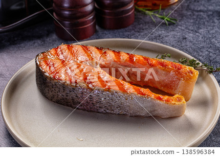 Grilled salmon steak served thyme Grilled salmon steak served thyme 138596384