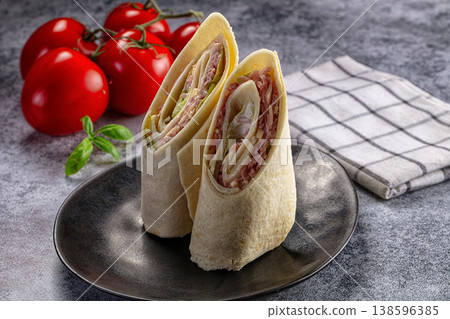 Wrap roll tortilla with ham and cheese Wrap roll tortilla with ham and cheese 138596385