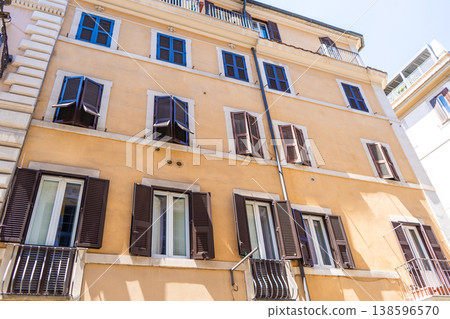 Italy Rome balcony street house facade. Old building architecture in the city center. Italian window shutters 138596570