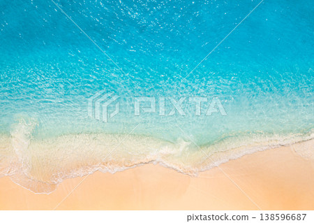 Breathtaking aerial summer beach calm waves pristine ocean top view, soft sand sunny beachfront landscape 138596687