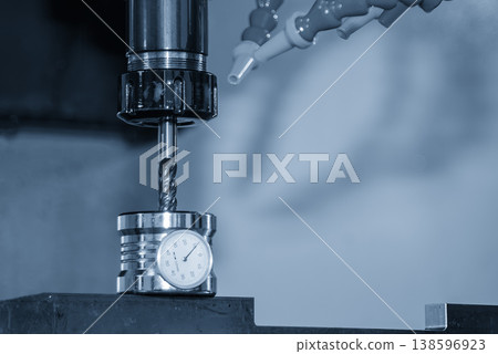 Precision tool length measurement process using a dial gauge indicator with a flat nose end mill for CNC milling. Precision tool length measurement process using a dial gauge indicator with a flat nose end mill for CNC milling. 138596923