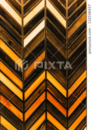 Wooden planks arranged in a dynamic chevron pattern, showing various natural wood tones and textures. Background for design projects, vertical banner Wooden planks arranged in a dynamic chevron pattern, showing various natural wood tones and textures. Background for design projects, vertical banner 138596937