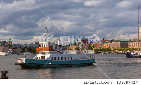 Passenger ferry on Stockholm waterfront in Sweden under cloudy sky Passenger ferry on Stockholm waterfront in Sweden under cloudy sky 138597427