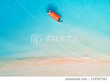 Aerial drone view of boat in clear blue sea in summer. Zanzibar Aerial drone view of boat in clear blue sea in summer. Zanzibar 138597561