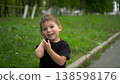 Three year old child walking in park talking on phone closeup. 4k 138598176