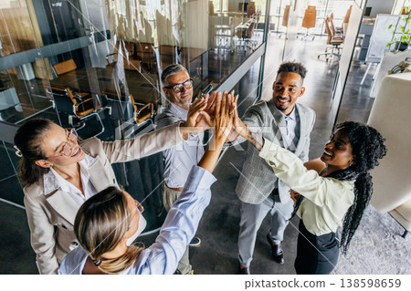 Group Of Professionals Expressing Excitement And Pride Following Significant Accomplishment Group Of Professionals Expressing Excitement And Pride Following Significant Accomplishment 138598659