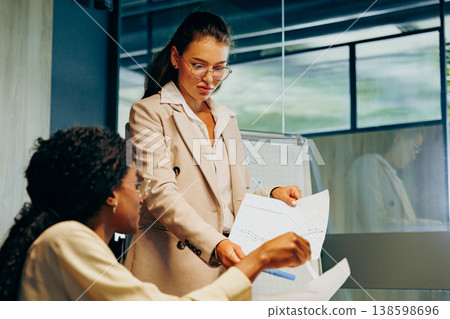 Professional accountants examine data sheets during meetings carefully 138598696