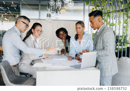 Multicultural Group Collaborates Actively. Multiracial Professionals Brainstorm During Dynamic Meeting 138598732