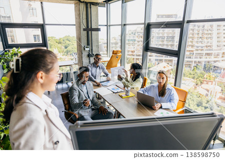 Business Founder Practices Pitch In Workspace. Innovator Rehearses Slide Deck With Team For Investors 138598750