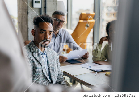 Focused Listener Engaged. Dedicated Attendee With Thoughtful Expression And Active Listening Skills 138598752