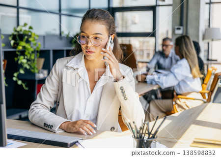Customer success specialist on call and reviewing files Customer success specialist on call and reviewing files 138598832