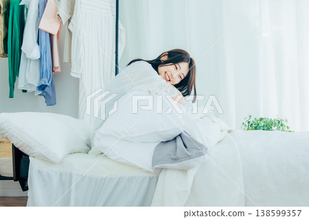 A woman waking up in the morning A woman waking up in the morning 138599357