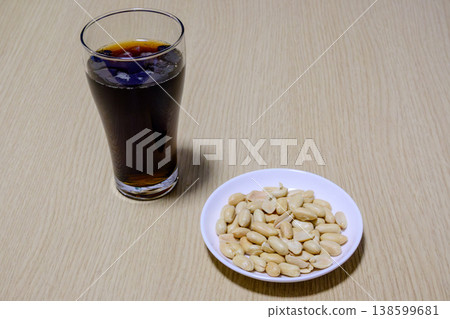 Cola and peanuts: A simple snack and drink. Cola and peanuts: A simple snack and drink. 138599681
