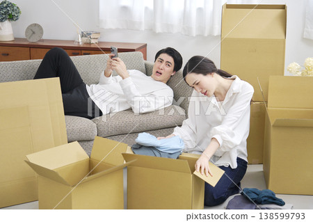 A man looking at his smartphone while moving, and a tired woman. A man looking at his smartphone while moving, and a tired woman. 138599793