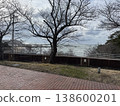 The sea in March, viewed from a brick-paved path. 138600201