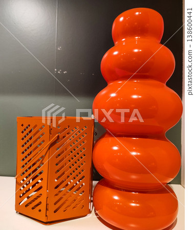 Vibrant Orange Decorative Objects with Unique Curves and Patterns in a Modern Interior Setting Vibrant Orange Decorative Objects with Unique Curves and Patterns in a Modern Interior Setting 138600441