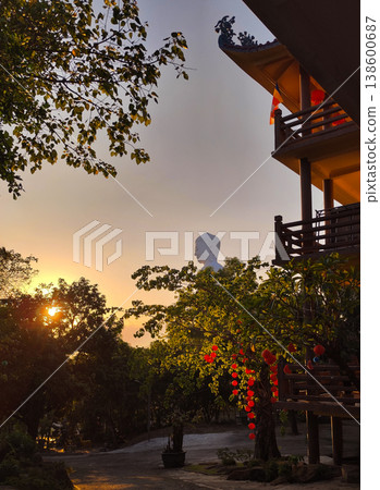 Buddha statue at sunset with red lanterns Tong Lam Son Temple Nha Trang Vietnam 138600687