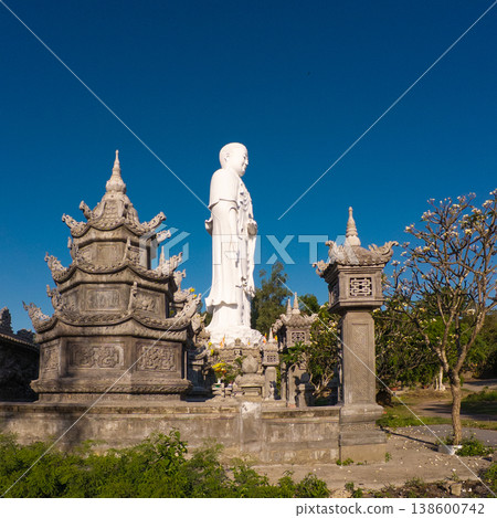 Standing Buddha statue against sky at Tong Lam Son Temple Nha Trang Vietnam 138600742