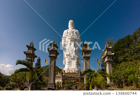 Standing Buddha statue against sky at Tong Lam Son Temple Nha Trang Vietnam Standing Buddha statue against sky at Tong Lam Son Temple Nha Trang Vietnam 138600744