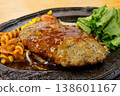 Hamburg steak served on a hot plate - a Western-style dish. 138601167