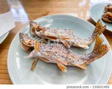 Freshwater fish dishes. Salt-grilled amago (yamame), the queen of mountain streams. Grilled fish in Japanese cuisine. 138601460