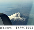Mount Fuji, covered in snow, as seen from an airplane. 138601553
