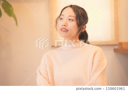 A daughter prays for her deceased loved one at home (retro style) A daughter prays for her deceased loved one at home (retro style) 138601961