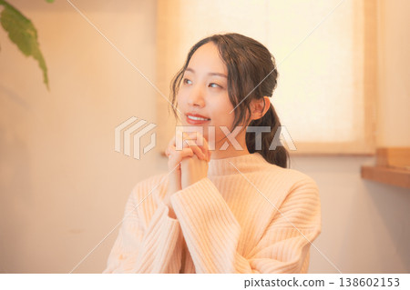 A daughter prays for her deceased loved one at home (retro style) A daughter prays for her deceased loved one at home (retro style) 138602153