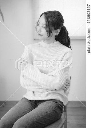 A daughter prays for her deceased loved one at home (black and white) A daughter prays for her deceased loved one at home (black and white) 138603167