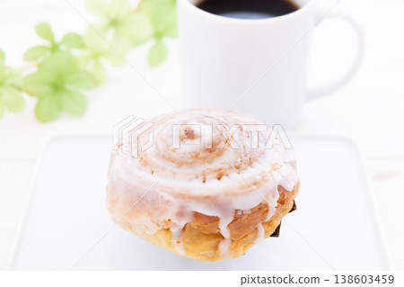 Delicious cinnamon rolls and coffee Delicious cinnamon rolls and coffee 138603459