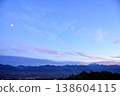 The Kofu Basin as dusk approaches, the moon, and Mount Fuji. 138604115